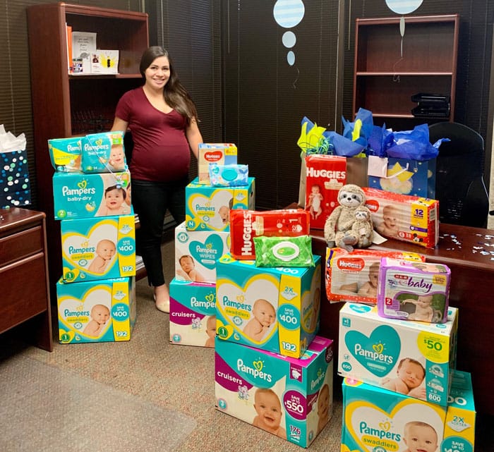 Diaper shower celebration with gifts.