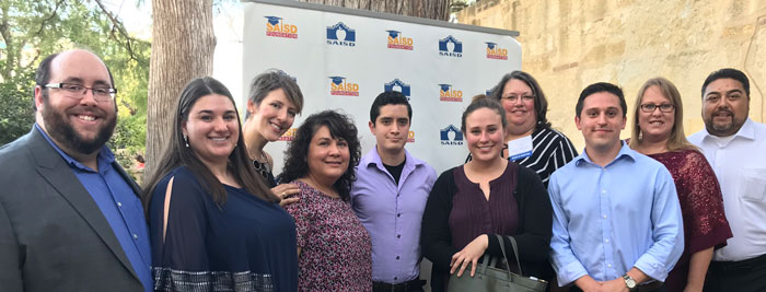 Group photo with people celebrating together.