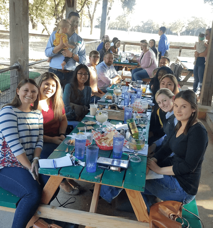 Group gathering around a table.