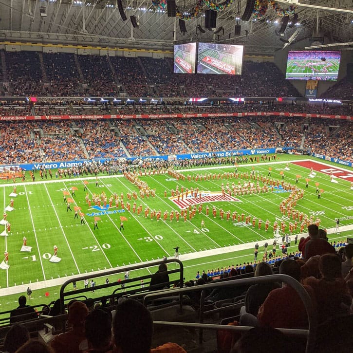 Football game with halftime performance.
