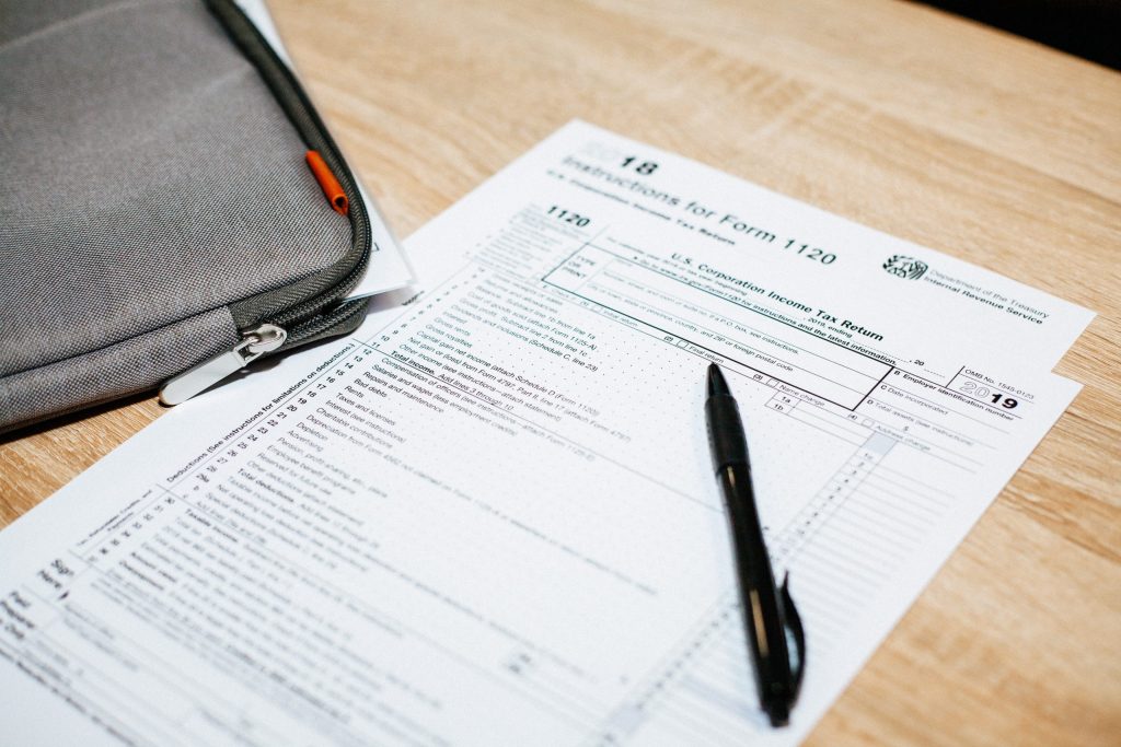 Tax form and pen on table