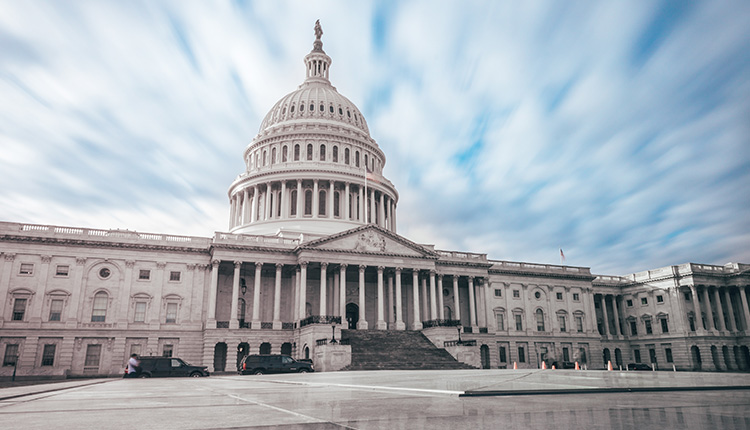 U.S. Capitol building under cloudy sky