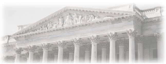 Classical building with columns and sculptures.