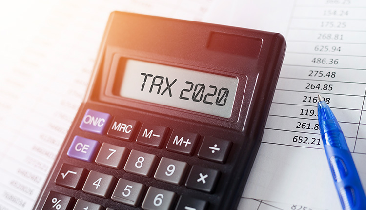 Calculator displaying 'TAX 2020' documents