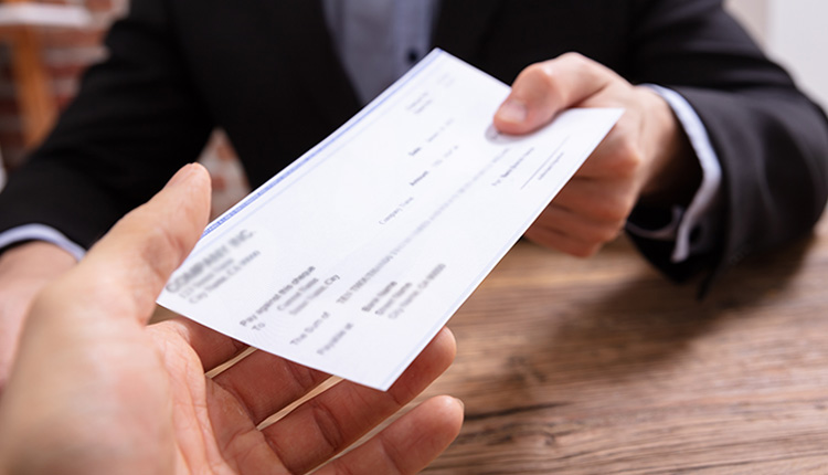 Handing over a check between hands.