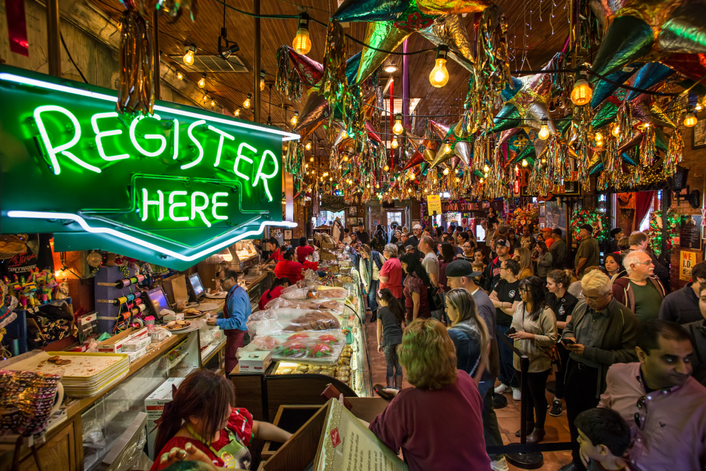 Busy festive market with colorful decorations.