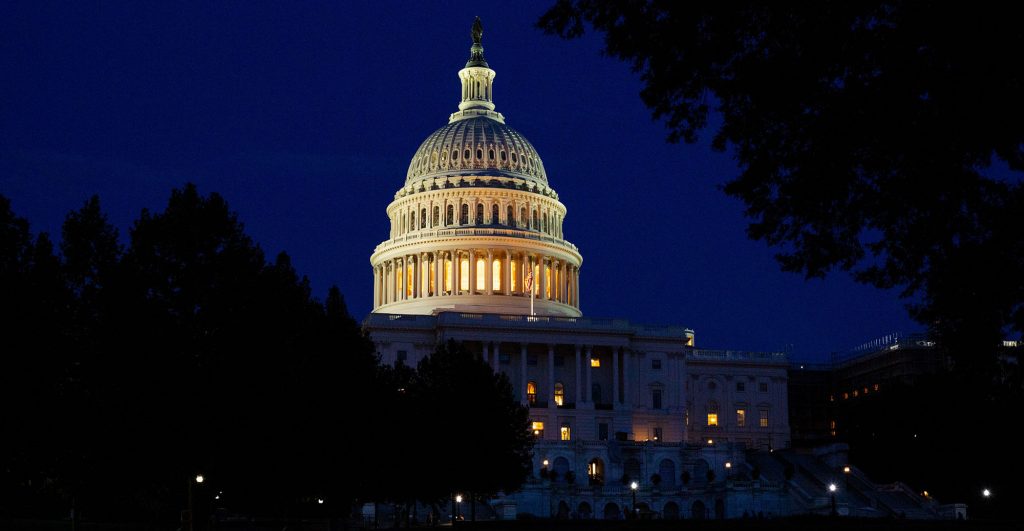 U.S. Capitol building illuminated at night
