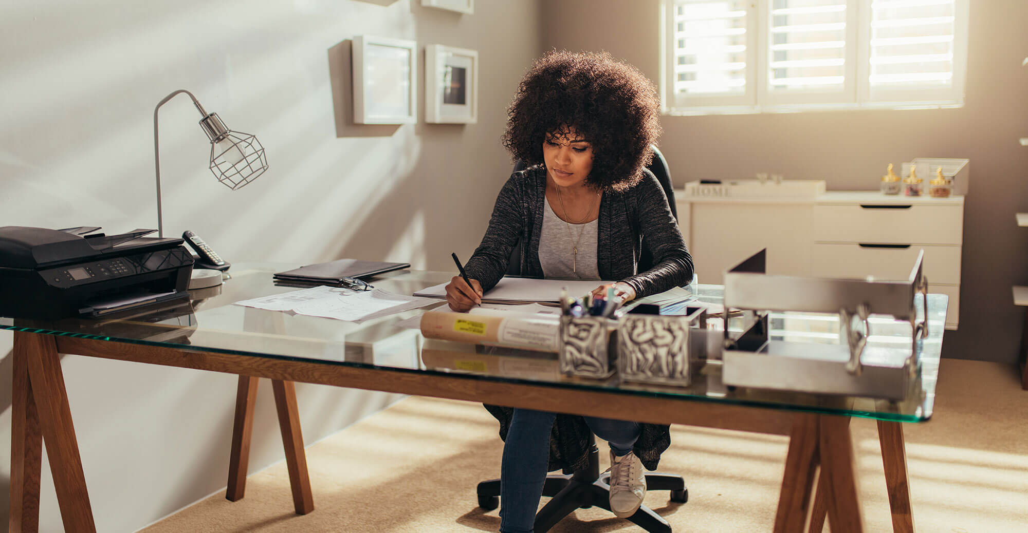 Person working at a modern desk.