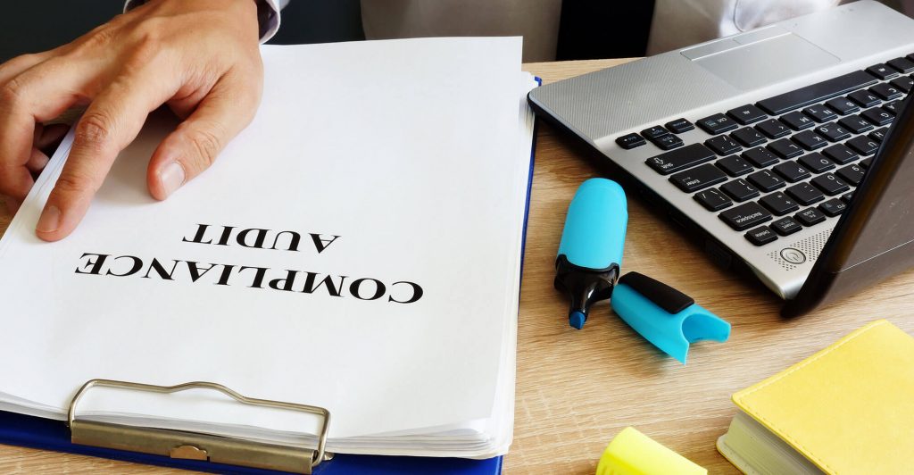 Documents and laptop on a desk
