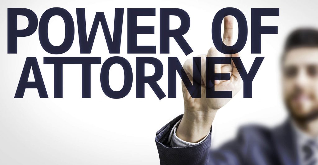 Hand pointing at legal document text
