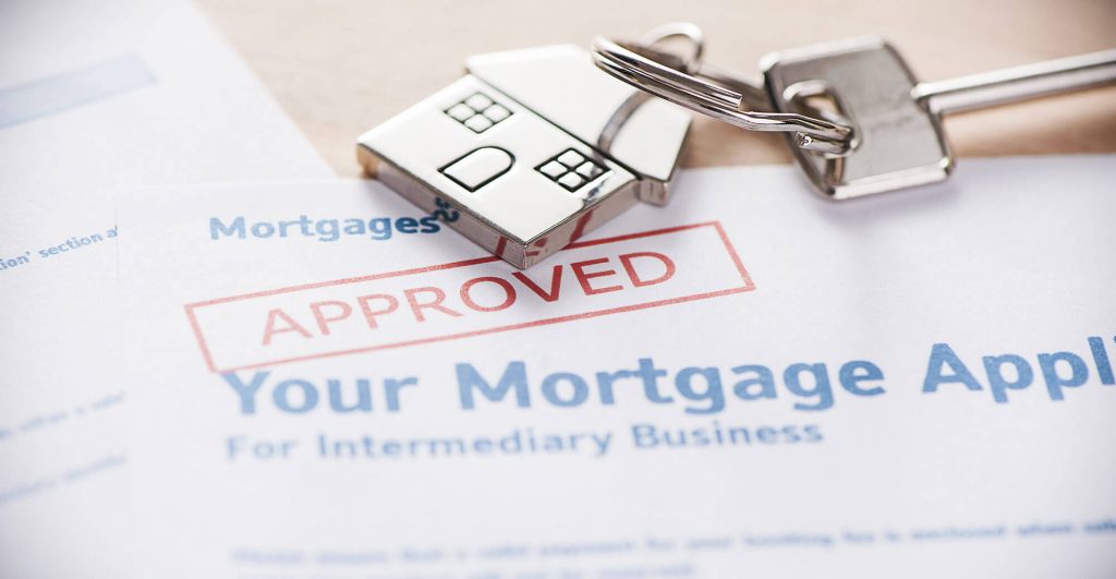 Mortgage application approved with house key