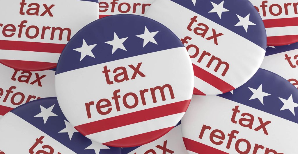 Buttons promoting tax reform initiative