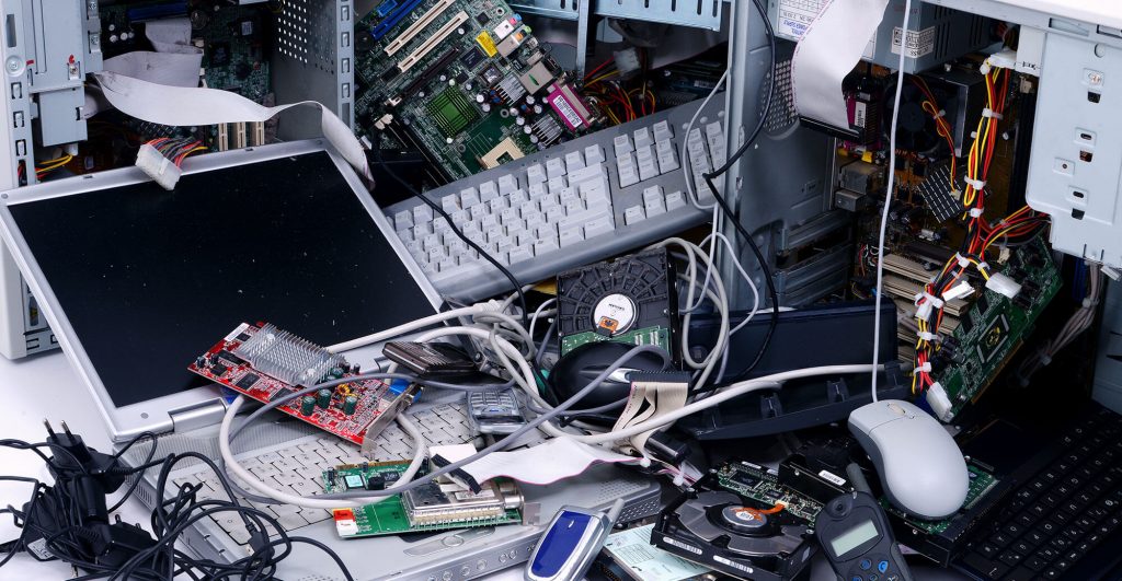 Cluttered electronic waste and components.