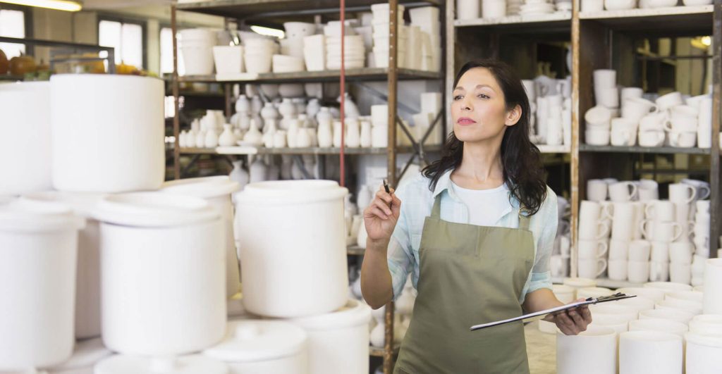 Person counting items in storage.