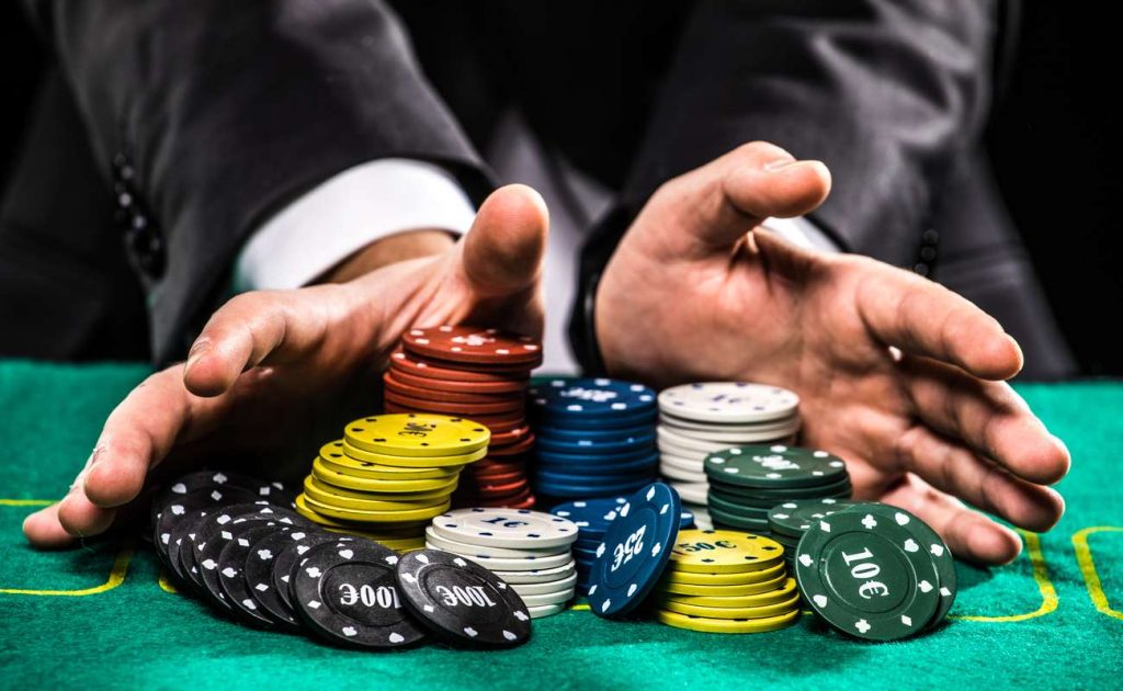 Hands with colorful poker chips