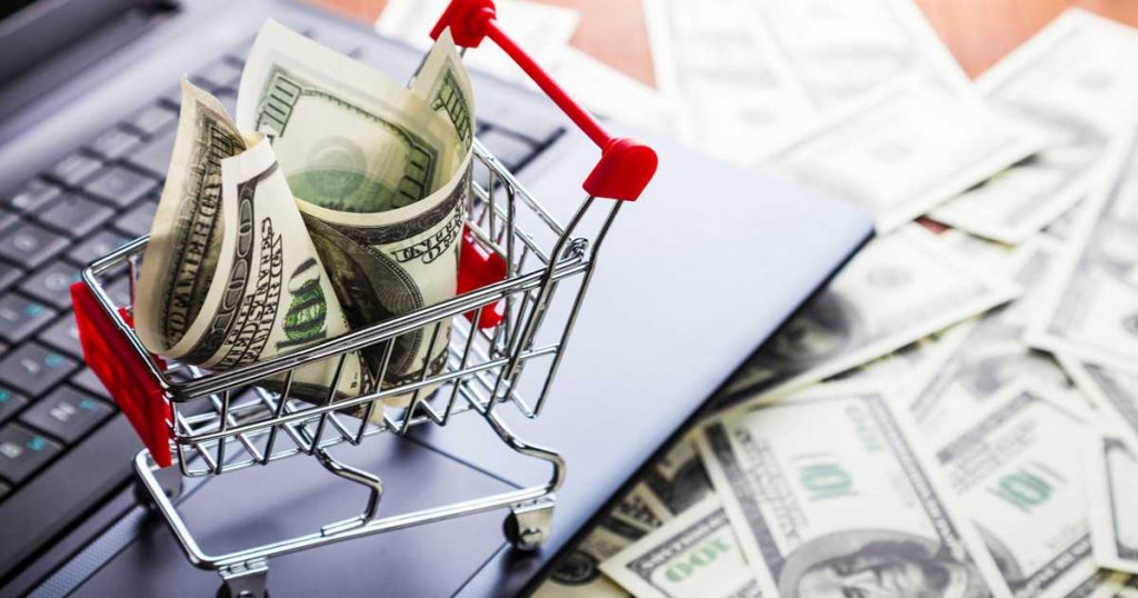 Shopping cart filled with cash