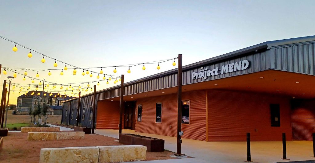 Modern building with outdoor lighting.