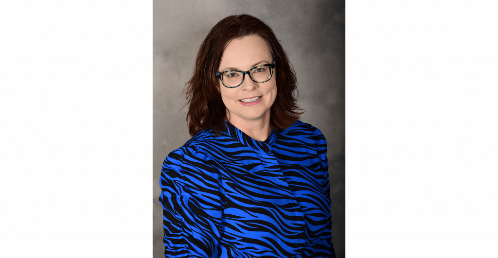 Person in blue zebra print blouse