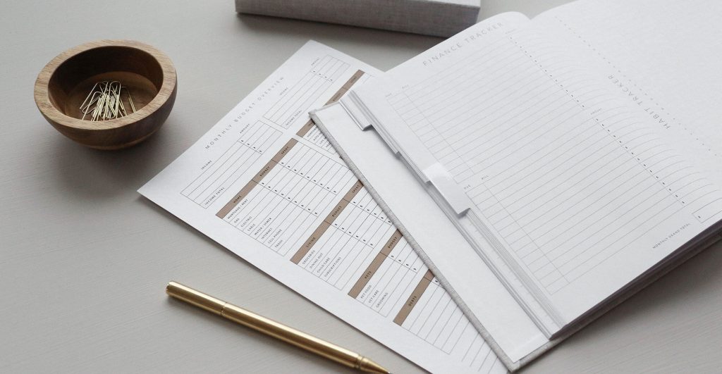 Stationery with planner and pen.