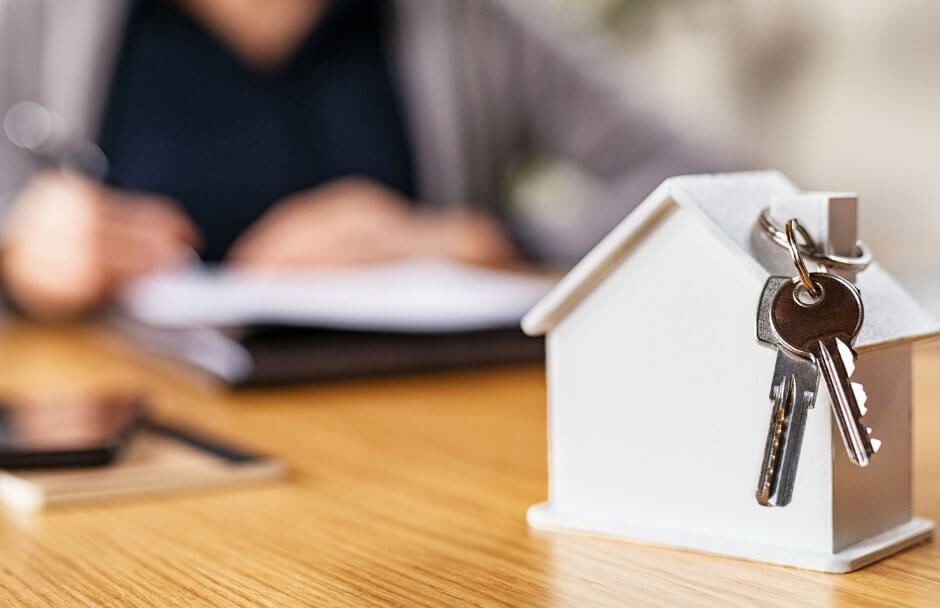Model house with keys on table