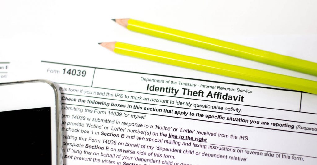 Tax affidavit with pencils and phone