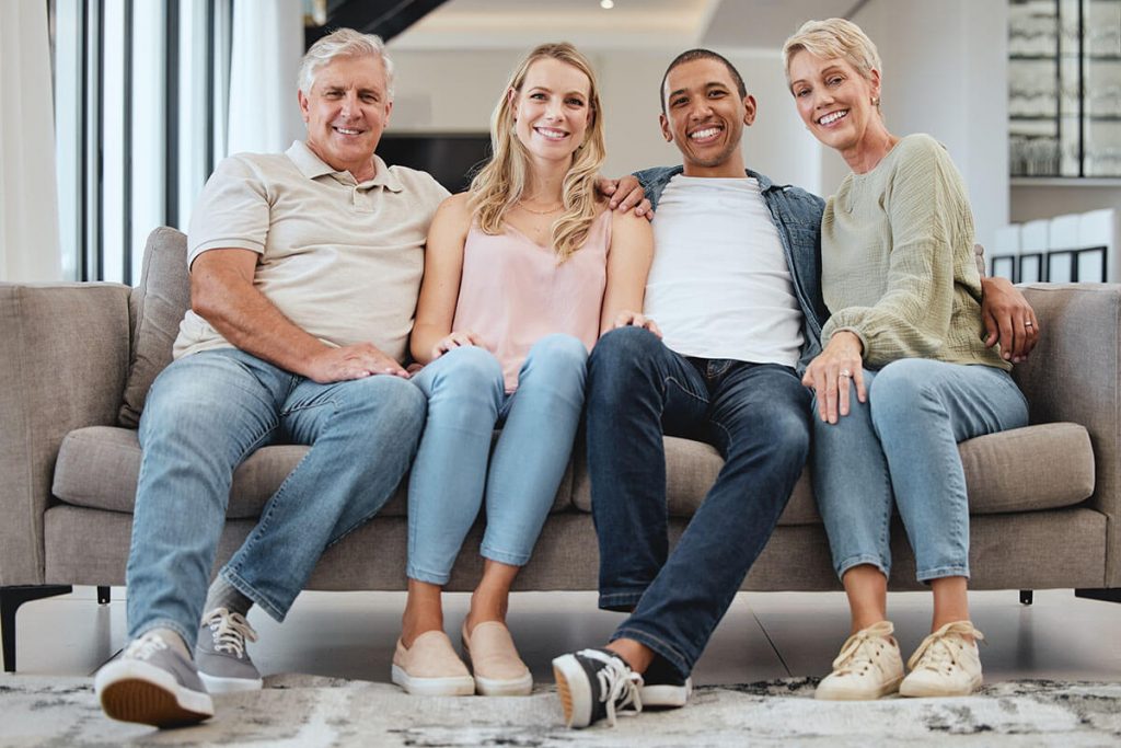 Group of four people on couch.