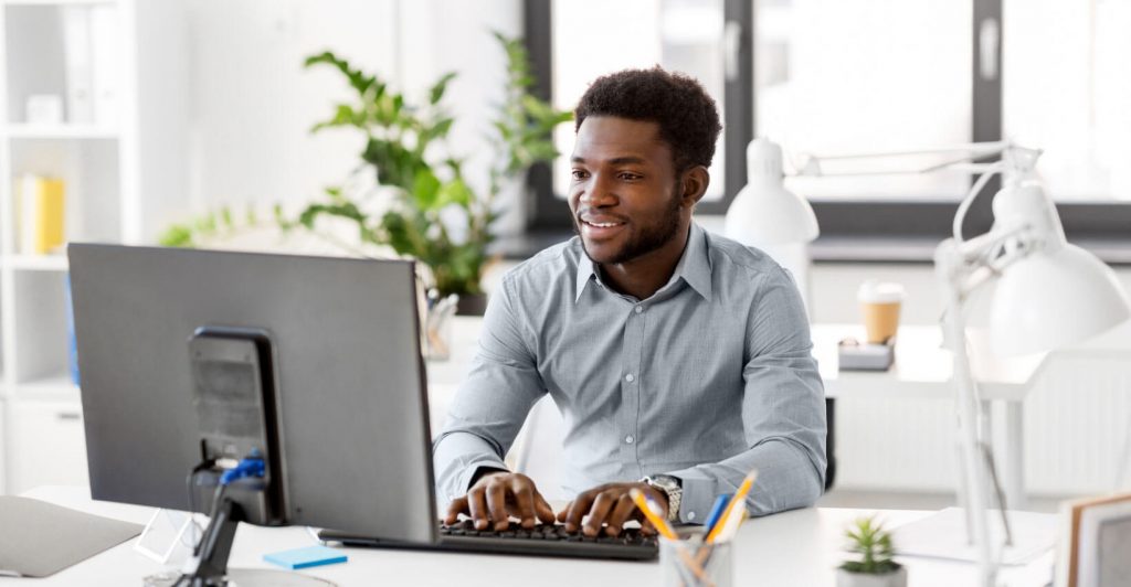 Person working at a desk computer.