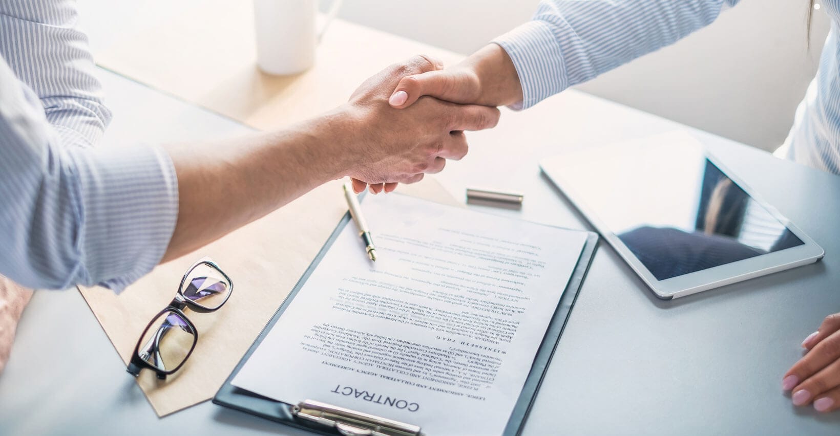 Handshake over a contract agreement.