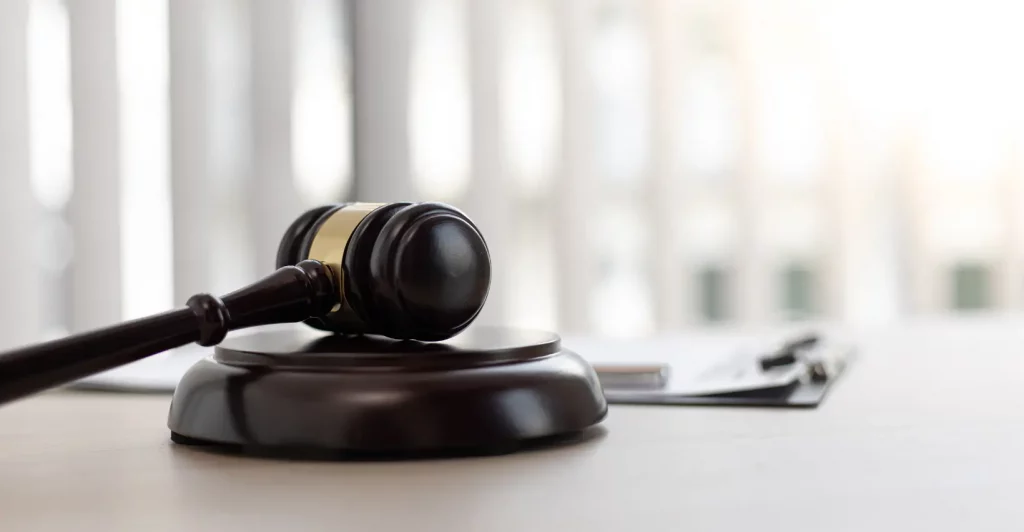 Gavel on a wooden base.