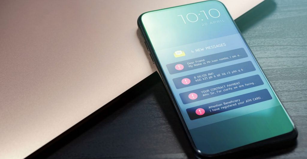 Smartphone displaying scam messages alerts