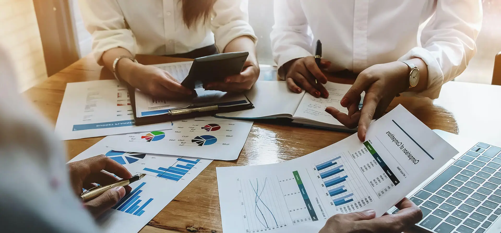 People analyzing financial reports together