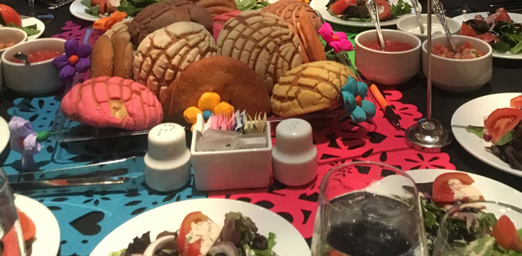 Colorful dinner table with various breads