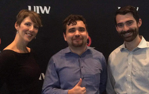 Three people posing for a photo.